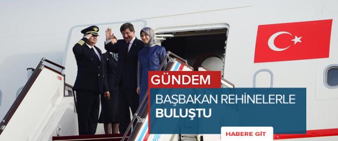 Davutoğlu, kurtarılan rehinelerle uçakta buluştu