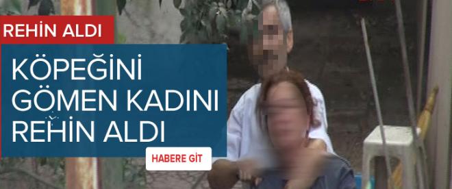 Köpeğini gömen kadını rehin aldı