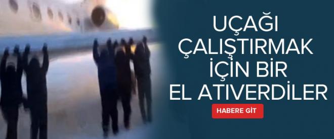 Yolcular uçağı itti